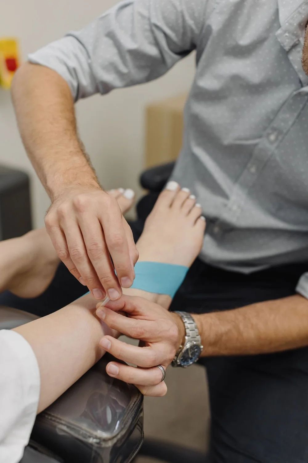 JS Podiatry podiatrist performing dry needling on a patient's lower limb